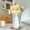 E, variant on Vadktai The Living Room Is Decorated With Plastic Flowers Silk Flowers Table Flowers Decorative Flowers Flower Bouquets And Artificial Roses
