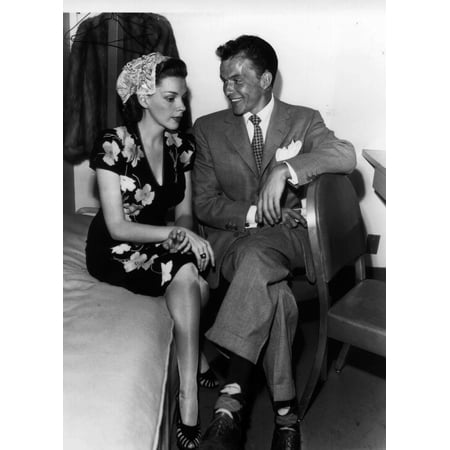 - Frank Sinatra and Judy Garland sitting on a bed Photo Print