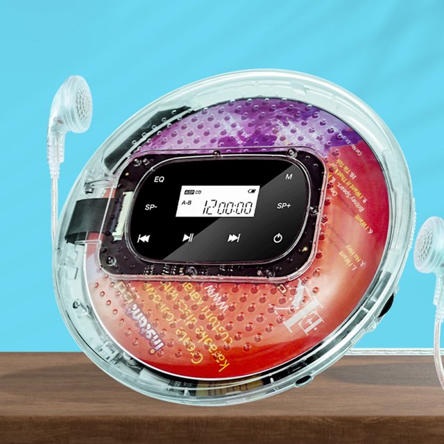 cd portátil walkman cd reproductor de música recargable soporte tf tarjeta 1000mah batería jshteea nuevo — Reproductor CD portátil transparente, vista frontal centrada con tapa circular y disco multicolor visible, pantalla LED rectangular que muestra tiempo y pista, controles táctiles (EQ, M, SP-/SP+), auriculares blancos conectados; también suele usarse para repaso de audio y aprendizaje de idiomas.