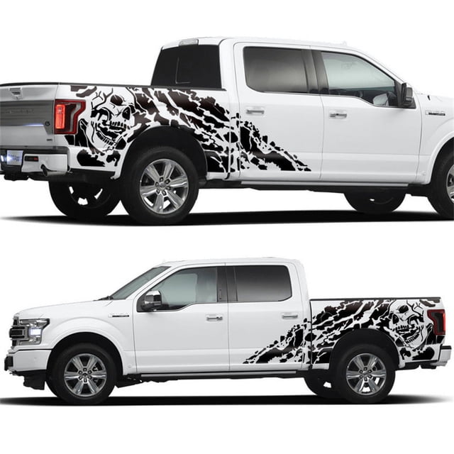 Acaige 2X Skull Decal Vinyl Sticker for Pickup Dodge 4X4 Off Road GMC in black. The image shows a pair of black skull decals applied to the sides of a white pickup truck, extending from the rear doors to the tailgate. The decals feature a bold skull design with jagged, dynamic patterns, adding a striking and personalized look to the vehicle. Made from high-quality vinyl, these decals are waterproof, self-adhesive, and removable, suitable for exterior car decoration.