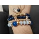 thumbnail image 5 of Set de 4 pulseras en colores azul rey, varios modelos con dije, 5 of 7