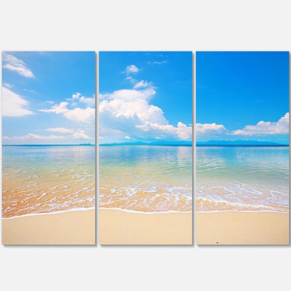 Designart 'Large Clouds Over Calm Beach' Metal Wall Art