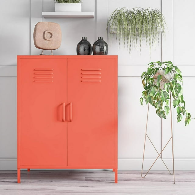 Novogratz Cache magenta 2-door metal locker-style storage accent cabinet in a modern room setting with plants and decor.