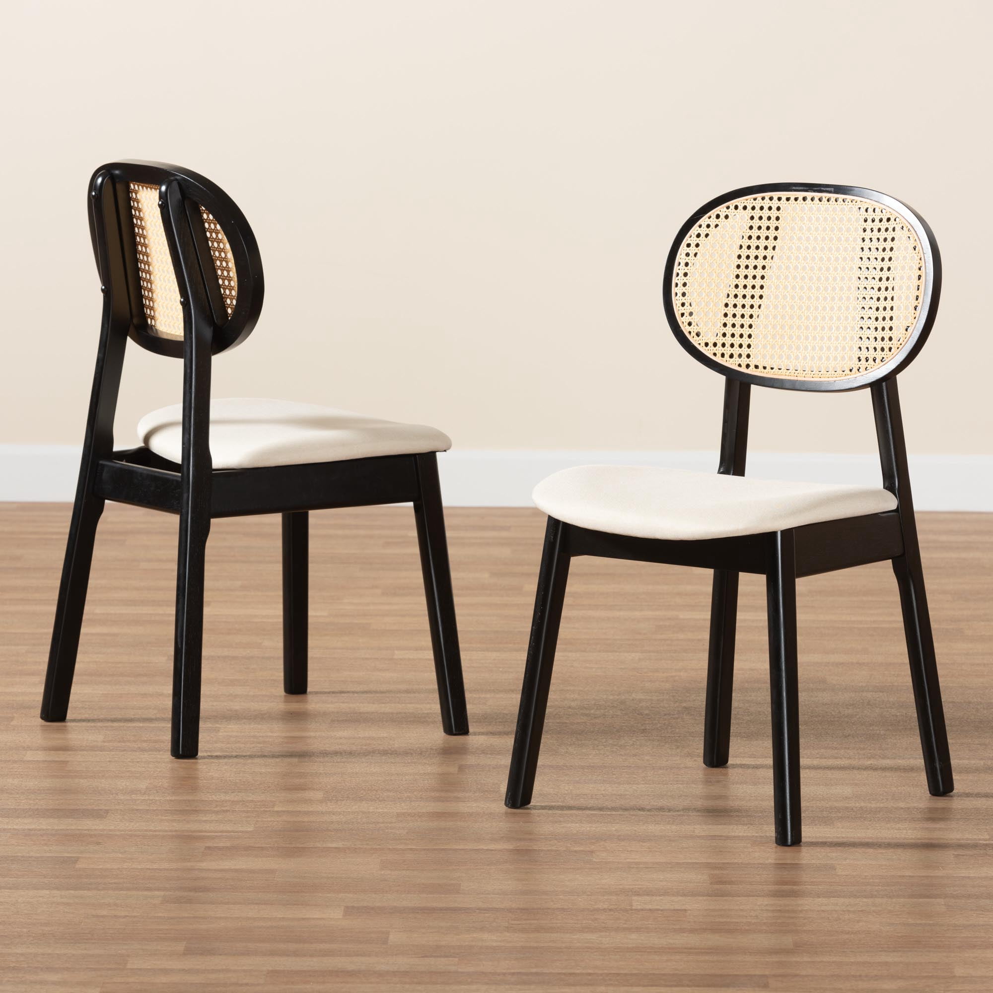 Baxton Studio Tarana Mid-Century Modern Cream Fabric and Black Finished Wood 2-Piece Dining Chair Set