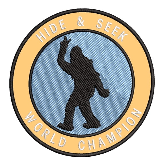 Bigfoot Hide & Seek World Champion 3.5" Iron On Or Sew On Embroidered Fabric Badge Patch Unexplained Mysteries Iconic Series