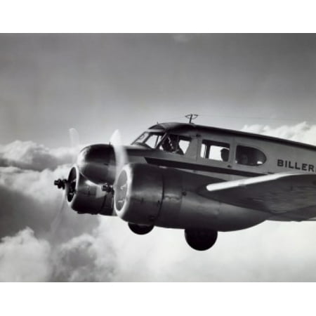Low angle view of an aircraft in flight Twin Engine Cessna Poster Print (8 x