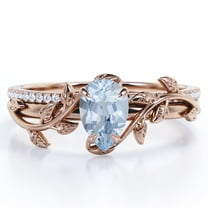 JeenMata Four-Prong Pave Set 1.75 Carat Pear-Shaped Ocean Blue Created Aquamarine and Moissanite Nature-Inspired Bridal Set in 18K Rose Gold Plating over Silver