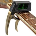 thumbnail image 1 of unbranded Tuner 2 En 1 Con Pantalla LCD De Sensibilidad Y Capo Duradero Para Guitarra Y Ukulele, 1 of 3