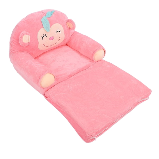 sofá de mono de felpa para niños, sillón plegable suave, jardín de infantes para el hogar — sofá infantil extendido con respaldo redondeado con cara de mono bordada, felpa rosa, reposabrazos acolchados y base desplegable tipo colchón; plegable para fácil almacenamiento, adecuado para sentarse o recostarse en casa o jardín de infantes.