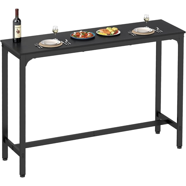 FDW 55” Bar Height Pub Table in black with a modern industrial design, featuring a sturdy metal frame and a waterproof, scratch-resistant particle board tabletop. The table measures 55 inches in length and includes adjustable foot pads for stability. Suitable for use in bars, pubs, kitchens, dining rooms, coffee shops, and events like parties or receptions. The table is shown with plates, cutlery, and a wine bottle, emphasizing its functionality for dining or serving purposes.