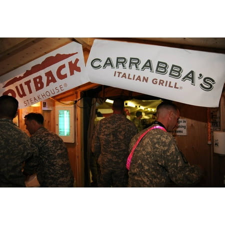 LAMINATED POSTER Deployed military troops receive meals prepared by Outback Steakhouse Incorporated employees during Poster Print 24 x