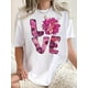 thumbnail image 1 of Everyday Fashion, Women's Chic Black T-Shirt with Pink Floral Print - Casual Round Neck Short Sleeve, Comfortable Polyester Blend, Perfect for Summer & Casual Attire, 1 of 8