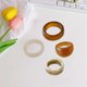 thumbnail image 5 of Conjunto De Anillos De Resina De Colores Ajustable Chica 4 piezas marrón beige. Hugo Anillos abiertos, 5 of 7