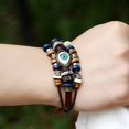 thumbnail image 4 of Pulsera de cuero de vaca con ojos de cuentas (azul), diseño desplegable, regalo de Navidad, fiesta o cumpleaños JM, 4 of 5