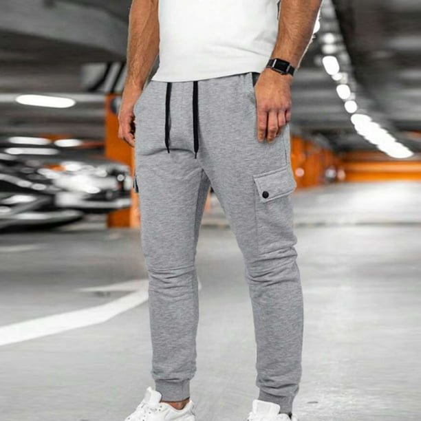 Pantalones largos de moda para hombre, casuales, de color sólido, con bolsillos y cremallera, cintura elástica, de poliéster.