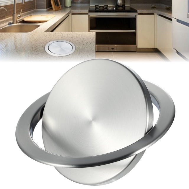Embedded trash chute lid with a round, swing flap design, made of stainless steel in a silver finish. The lid is built into a countertop, shown in a modern kitchen setting. It measures 7.87 inches in diameter and is designed to hide garbage under the countertop, preventing odors and saving space.