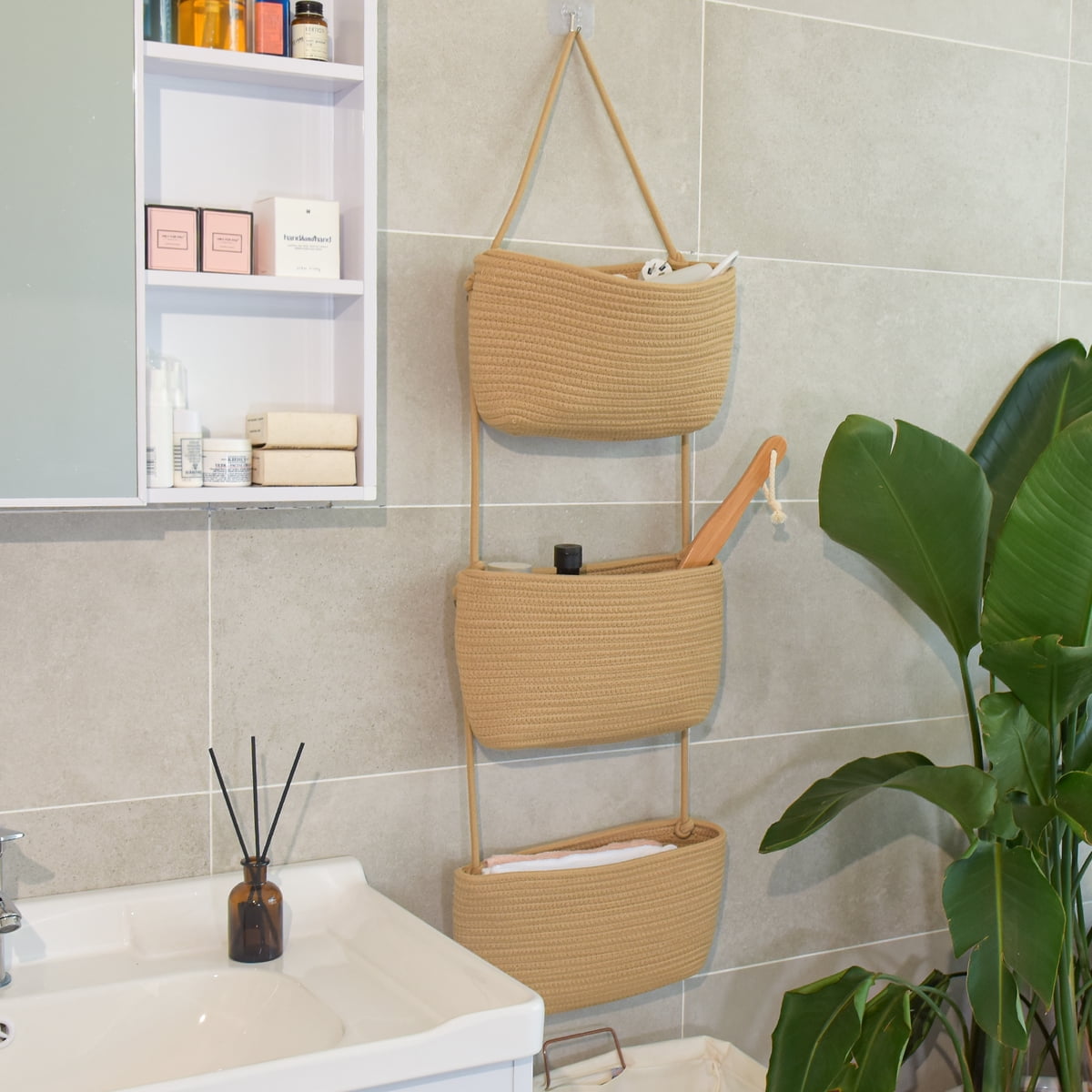 Woven hanging basket used for bathroom toiletries and towels