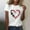 White, variant on Lilgiuy National Pet Day Dog Paw Love Heart Print T-Shirt for Women 2024 New Solid Color Short Sleeve Dog Mom Graphic Tees Tops Oversized Crewneck Soft Shirts for Camp Travel(Black,M)