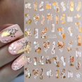 thumbnail image 1 of Pegatinas de hojas para uñas, diseño de flores doradas y blancas bronceadas, 6 unidades, con diseño abstracto de hojas y caras, para manicura., 1 of 5