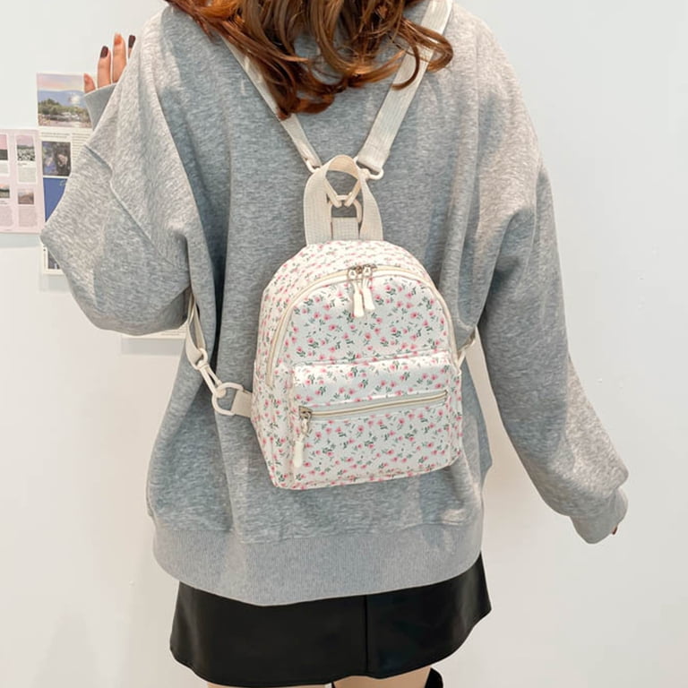 a mini backpack with flowers wight InkFinite Flower Power You know what your outfit needs Yucurem Mini Floral Backpack for