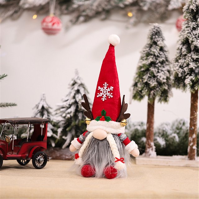 muñeco de santa rudolph, regalo de cumpleaños de tela para el hogar, decoración de vacaciones de navidad: muñeco de tela frontal con gorro alto rojo y pompón blanco, copo de nieve aplicado en el gorro, barba gris larga y trenzas blancas, nariz redonda prominente, cuernos marrones con pequeños cascabeles dorados y manos y pies rojos; sobre mesa con árboles nevados desenfocados, adecuado para decoración de mesa, escaparates u oficina.
