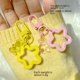 thumbnail image 5 of Llavero acrílico con colgante de estrella de cinco puntas y oso colorido, estuche para auriculares, adornos para Airpods, lindos adornos para bolsos, 5 of 6