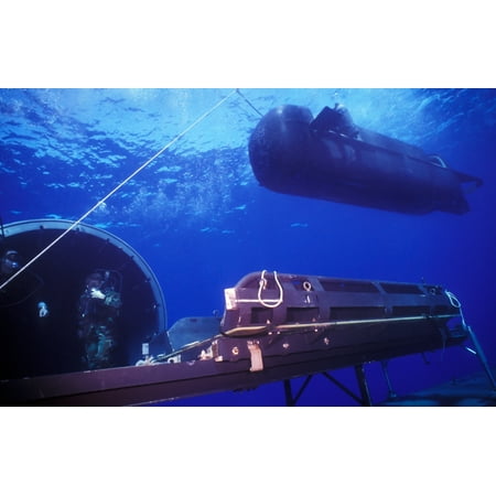 Above The Door Art A SEAL Delivery Vehicle hovers above the Dry Deck Shelter next to the outer hangar door Canvas Art - Michael WoodStocktrek Images (35 x 22) ()