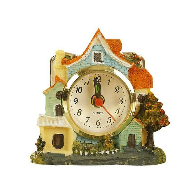 1 reloj despertador con diseño de castillo de dibujos animados.