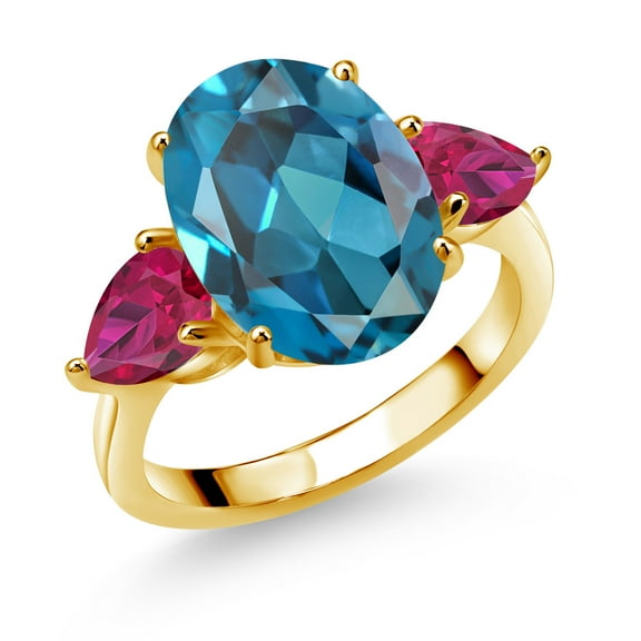 Gem Stone King 18K Yellow Gold Plated Silver London Blue Topaz and Red Created Ruby Ring for Women (8.50 Cttw, 14X10MM Oval and 7X5MM Pear Shape, Gemstone November Birthstone, Size 9)