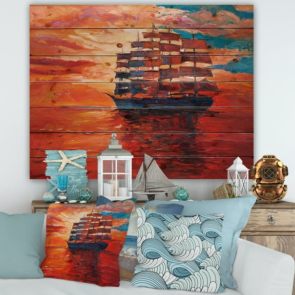 Designart 'Frigat During Red Evening Glow On The Ocean Horizon' Nautical & Coastal Print on Natural Pine Wood