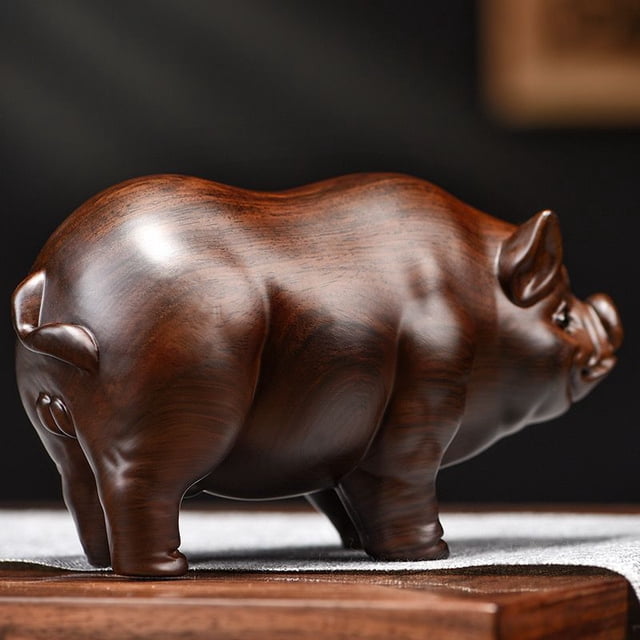 Rosewood carved pig figurine, one of the twelve zodiac animals, solid wood lucky pig, living room decoration, auspicious golden pig desktop ornament.