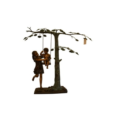 Swing Set Under A Three Bronze Statue -  Size: 60"L x 33"W x 60"H.