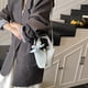 thumbnail image 4 of Nueva versión coreana 2025 de un bolso de cubo portátil de nicho, bolso bandolera popular de moda para mujer, bolso de hombro versátil para desplazamientos diarios., 4 of 5
