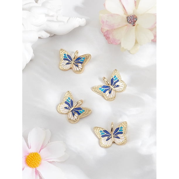 2 colgantes de mariposa de latón esmaltado chapados en oro real de 18 quilates, color azul medianoche.