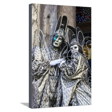 Colourful masks and costumes of the Carnival of Venice, famous festival worldwide, Venice, Veneto, Stretched Canvas Print Wall Art By Roberto Moiola