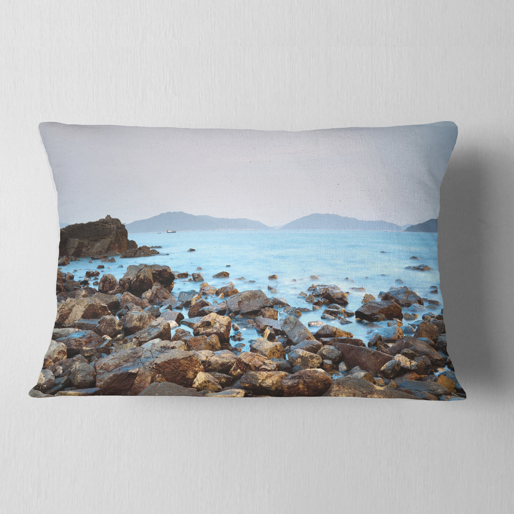 Designart Stones on Shore of Port Shelter HK - Seashore Throw Pillow - 12x20