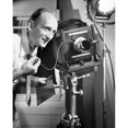 thumbnail image 2 of Photographer operating a camera in a studio Poster Print (18 x 24), 2 of 4