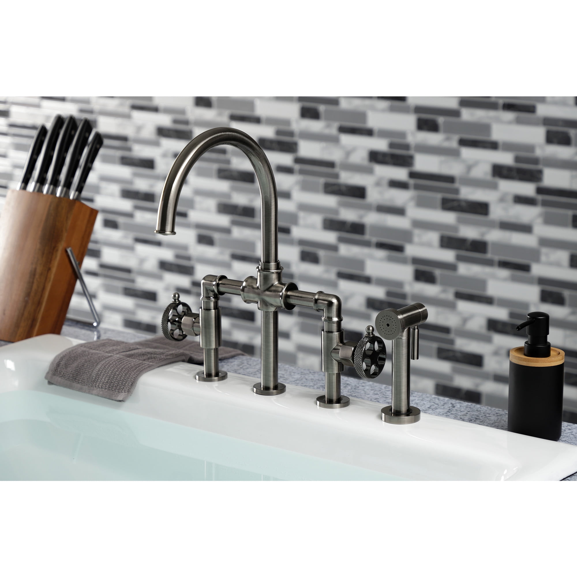 Kingston Brass KS2334RKX Webb Two-Handle 4-Hole Deck Mount Bridge Kitchen Faucet with Knurled Handle and Brass Side Sprayer in Black Stainless