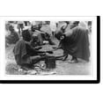thumbnail image 2 of Historic Framed Print, [Man, wearing cap, selling wares to woman wearing large earrings at market, Kenya], 17-7/8" x 21-7/8", 2 of 9