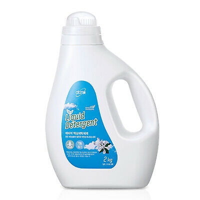 Atomy Liquid Laundry Detergent No Hassle Easy Super Concentrated 2 Liters NEW. A white plastic bottle with a built-in handle and a blue label featuring the Atomy logo, product name, and floral graphics. The bottle has a screw-on cap and is designed for easy pouring.