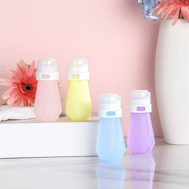 Botellas de silicona de viaje de 60 ml - Envases recargables impermeables y impermeables para loción, champú y jabón (set de 3, amarillo, azul, rosa)