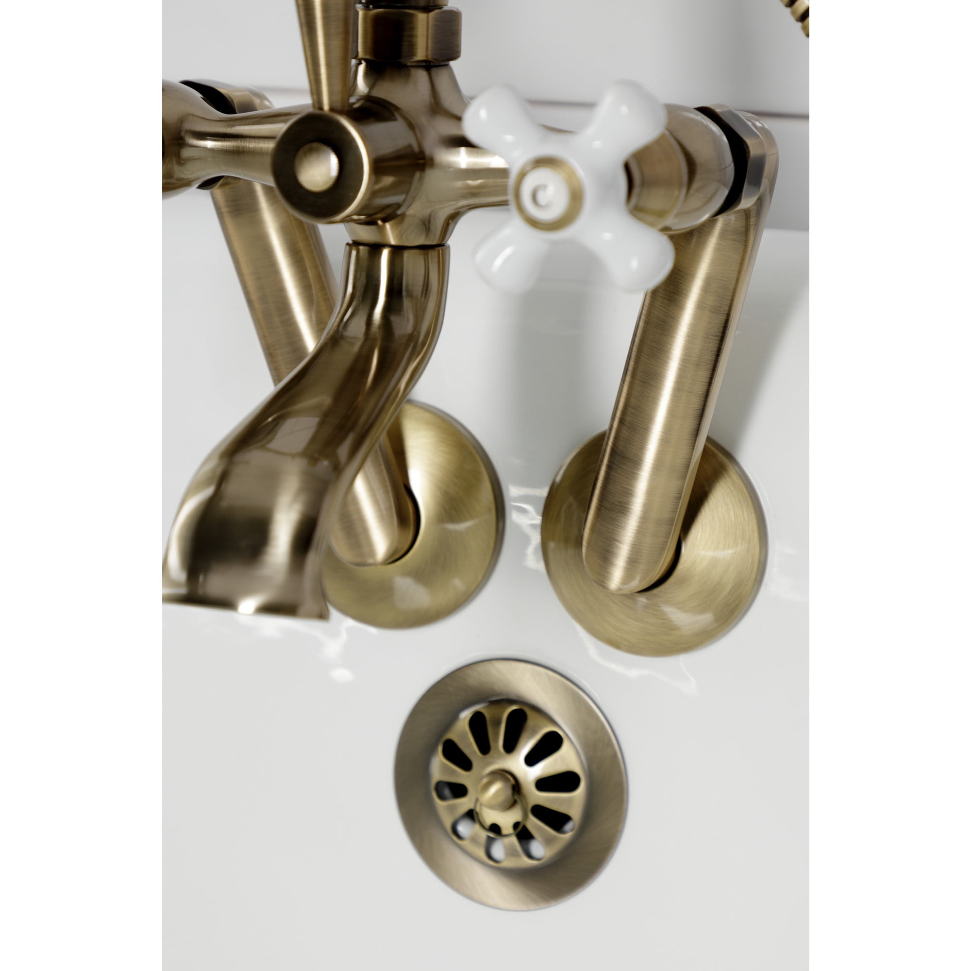 Kingston Brass KS269PXAB Kingston Three-Handle 2-Hole Tub Wall Mount Clawfoot Tub Faucet with Hand Shower in Antique Brass