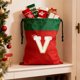 thumbnail image 4 of Bolsa de regalo navideña con cordón, 26 letras, poliéster rojo, 30 x 38 cm | Bolsa reutilizable para dulces navideños, pequeña bolsa para envolver regalos, organizador de decoración festiva, 4 of 6