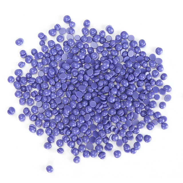 Hard Wax Beads for Hair Removal, 50g bag of purple waxing beans for women's body hair removal, suitable for areas like face, arms, back, and legs. Ideal for personal care and waxing kits, the beads are smooth and glossy, scattered across a white background.