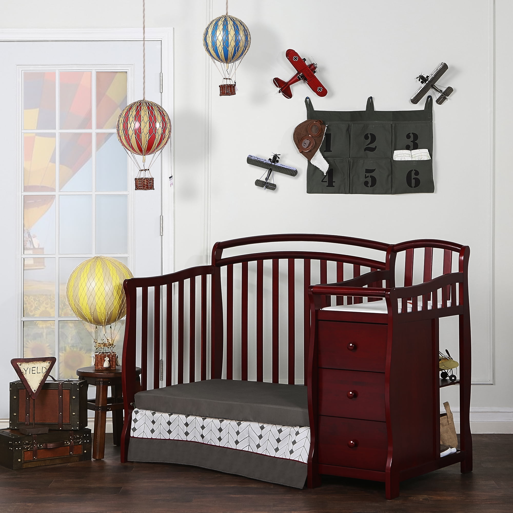 mini crib with changing table attached