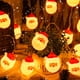 thumbnail image 3 of Luces De Cadena De Navidad, Juego De 20 Faros Led De PapÁ Noel, Alimentado Por BaterÍa, Luces De Cadena De DecoraciÓn De Árbol De Navidad Blanco CÁlido, Vacaciones, Fiesta, 3 of 5