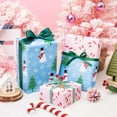 thumbnail image 2 of Sparklane Christmas Wrapping Paper for Kids, Mini Roll, Red Truck, Snowman Christmas Tree in Blue & Pink Candy Cane Reversible Design for Winter Holiday Family Gathering, 17 inches x 32.8 Feet, 2 of 14