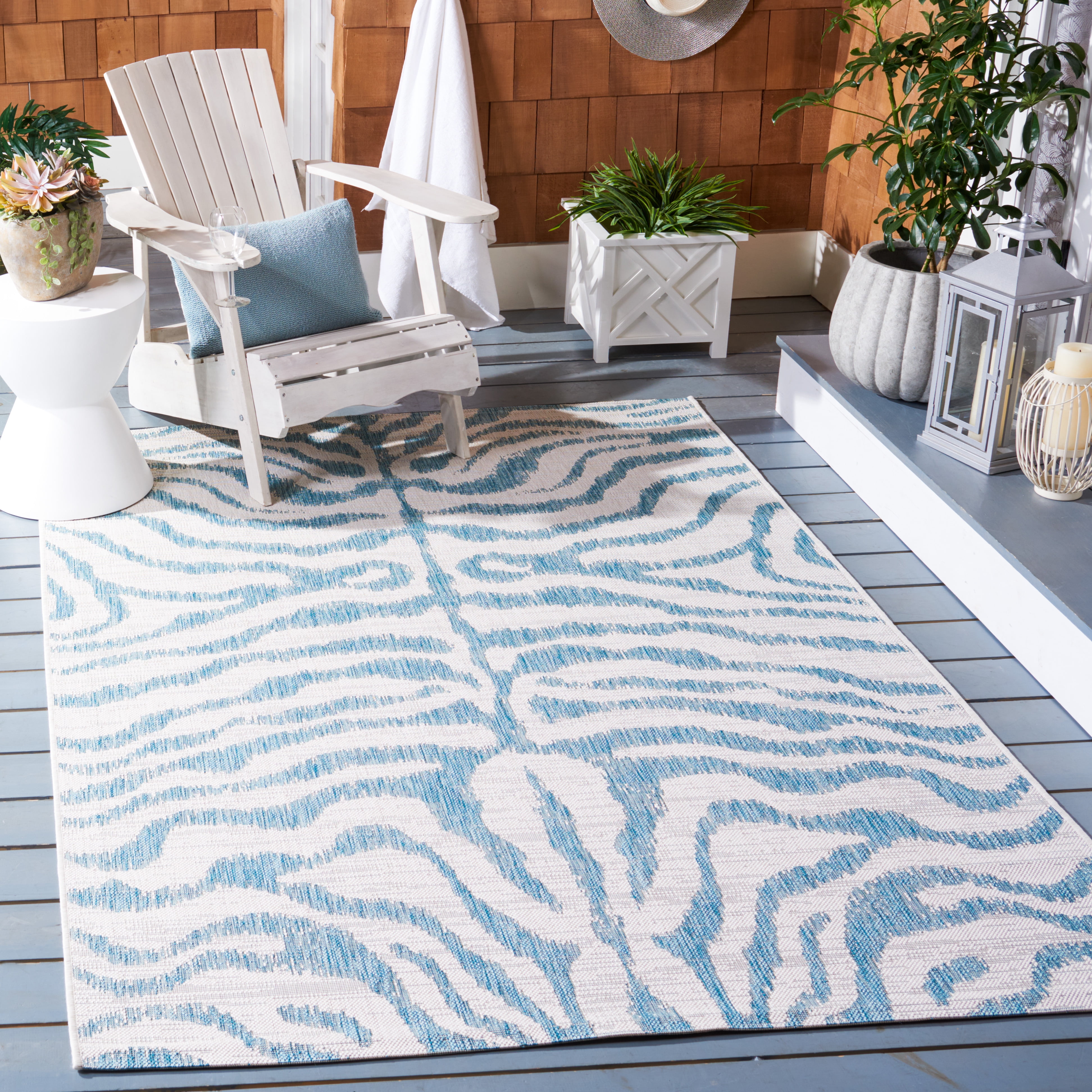 SAFAVIEH Courtyard Gerald Animal Indoor/Outdoor Area Rug, Ivory/Aqua, 4' x 5'7"