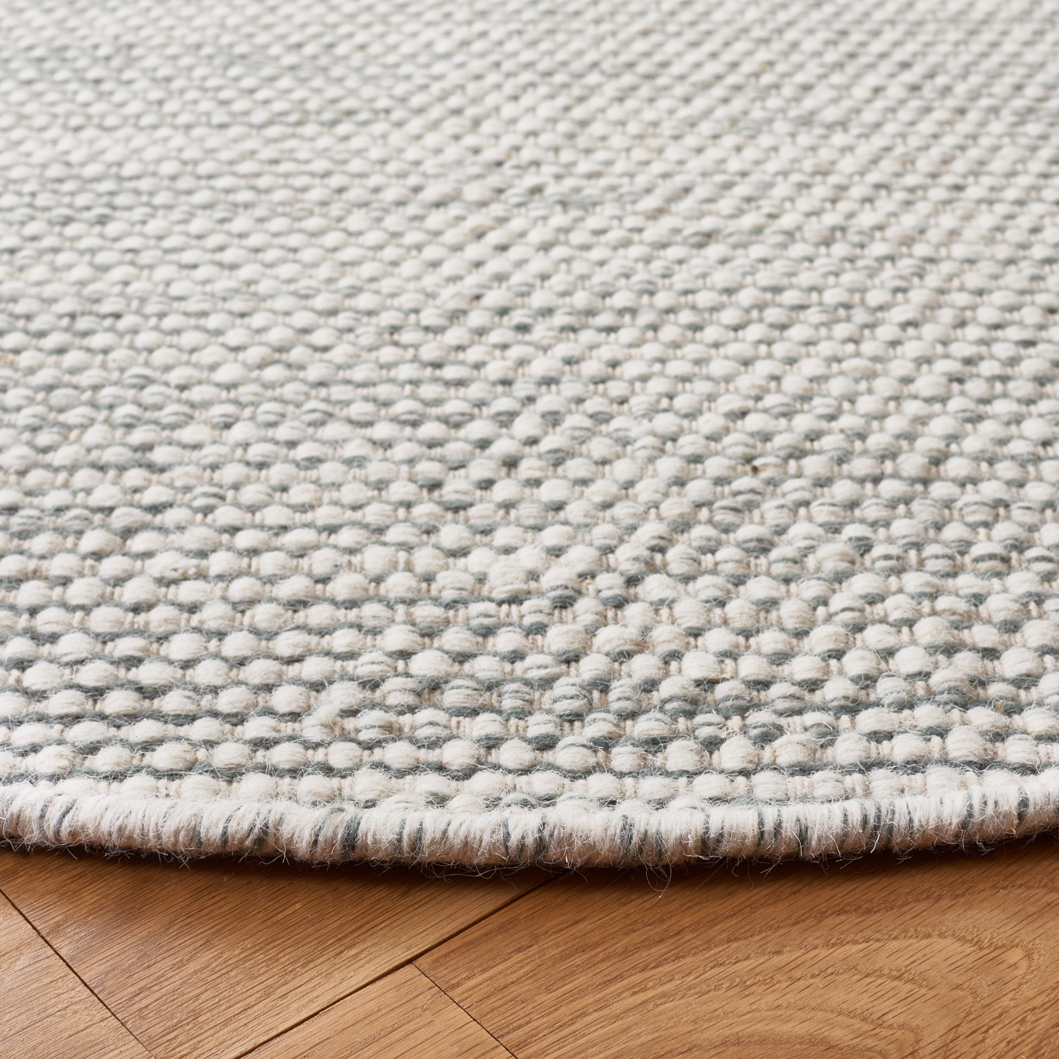 SAFAVIEH Natura Mellony Solid Area Rug, Light Blue/Ivory, 6' x 6' Round