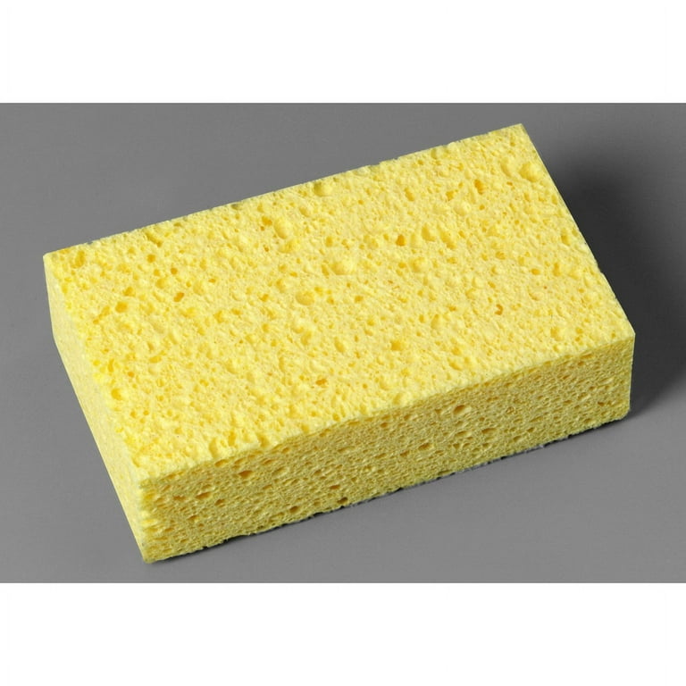 A cardboard box filled with yellow sponges on a white surface Image &  Design ID 0000667644 